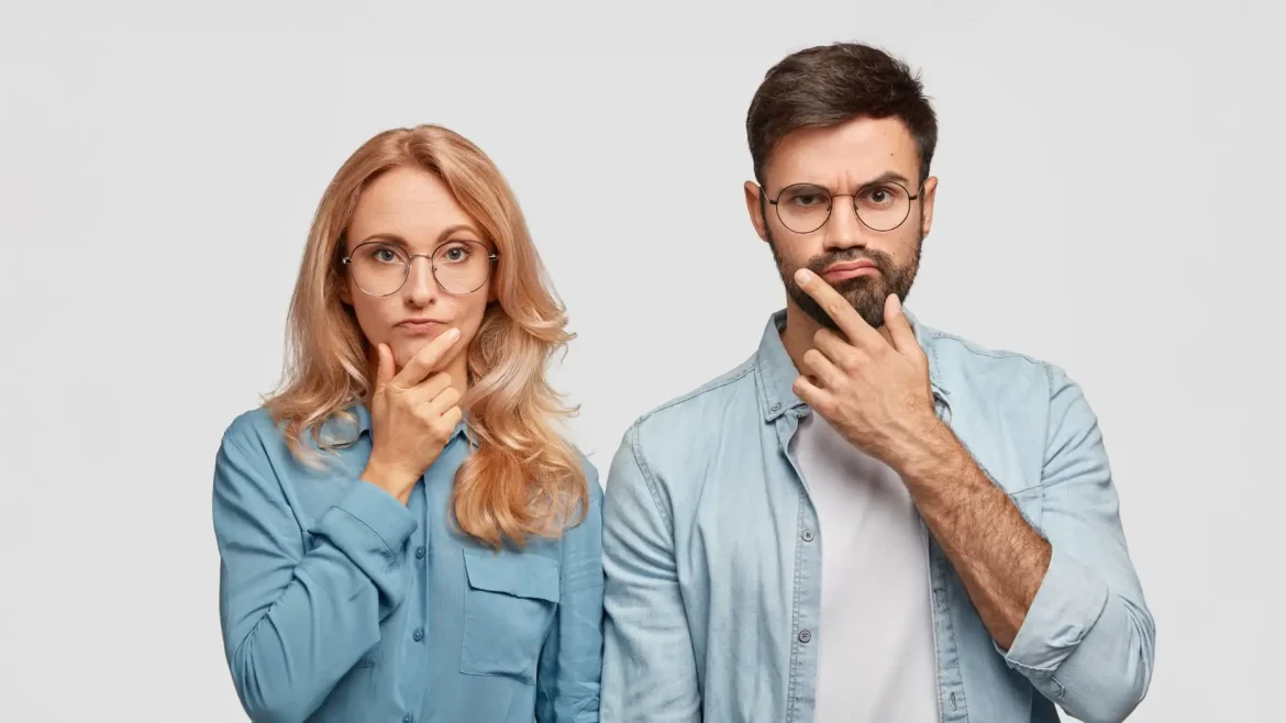 A man and a woman stand side by side, both with their hands on their chins and looking thoughtful, symbolizing learners reflecting on the time it takes to master English.