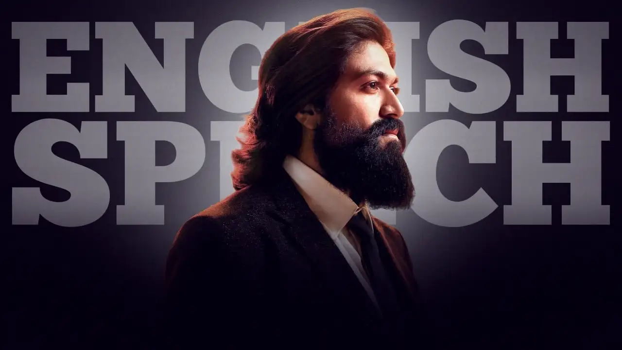 Man in a suit with a long beard standing in front of large text reading "ENGLISH SPEECH".
